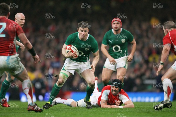 12.03.11 Wales v Ireland ... Ireland's Brian O'Driscoll gets past Jonathan Thomas. 
