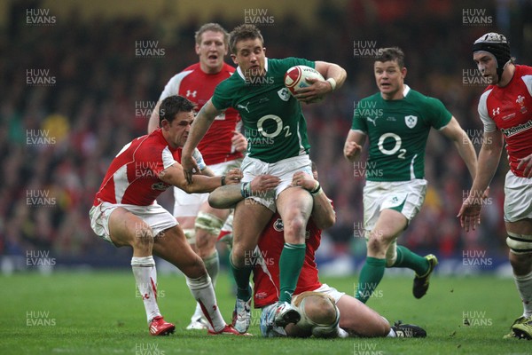 12.03.11... Wales v Ireland, RBS 6 Nations -  Ireland's Luke Fitzgerald is tackled by Wales' Paul James and Wales' Lee Byrne   