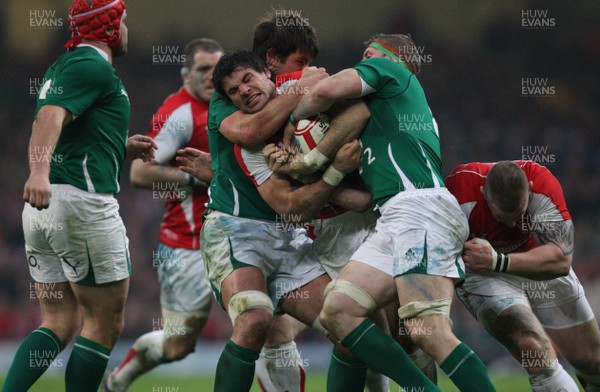 12.03.11... Wales v Ireland, RBS 6 Nations -  Wales' Mike Phillips is tackled by Ireland's Donncha O'Callaghan and Jamie Heaslip  