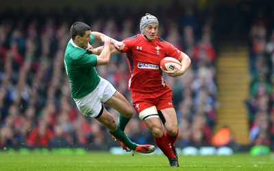 140315 - Wales v Ireland - RBS 6 Nations 2015 -Jonathan Davies of Wales gets away from Jonny Sexton of Ireland