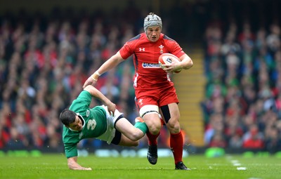 140315 - Wales v Ireland - RBS 6 Nations 2015 -Jonathan Davies of Wales gets away from Jonny Sexton of Ireland