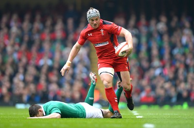 140315 - Wales v Ireland - RBS 6 Nations 2015 -Jonathan Davies of Wales gets away from Jonny Sexton of Ireland