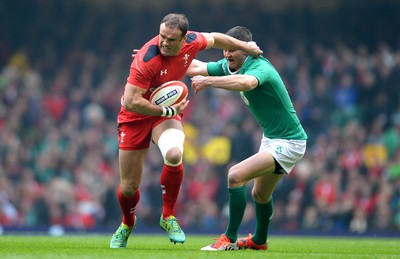 140315 - Wales v Ireland - RBS 6 Nations 2015 -Jamie Roberts of Wales is tackled by Jonny Sexton of Ireland