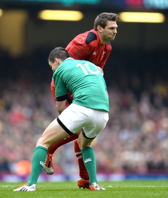 140315 - Wales v Ireland - RBS 6 Nations 2015 -Dan Biggar of Wales is tackled by Jonny Sexton of Ireland