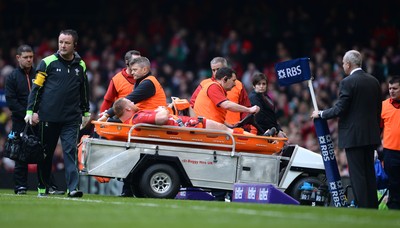 140315 - Wales v Ireland - RBS 6 Nations 2015 -Samson Lee of Wales leaves the field with an injury