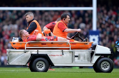 140315 - Wales v Ireland - RBS 6 Nations 2015 -Samson Lee of Wales leaves the field with an injury