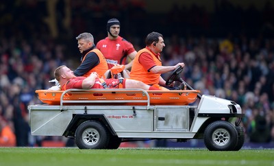 140315 - Wales v Ireland - RBS 6 Nations 2015 -Samson Lee of Wales leaves the field with an injury