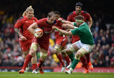 140315 - Wales v Ireland - RBS 6 Nations 2015 -Alun Wyn Jones of Wales is tackled by Jamie Heaslip of Ireland