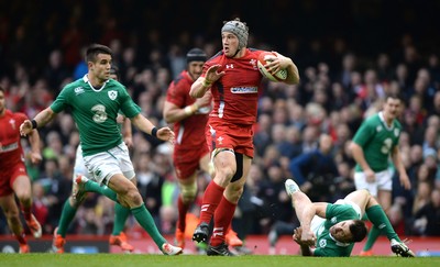 140315 - Wales v Ireland - RBS 6 Nations 2015 -Jonathan Davies of Wales is tackled by Conor Murray and Tommy Bowe of Ireland