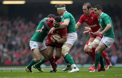 140315 - Wales v Ireland - RBS 6 Nations - Scott Baldwin of Wales is tackled by Jared Payne and Jamie Heaslip of Ireland