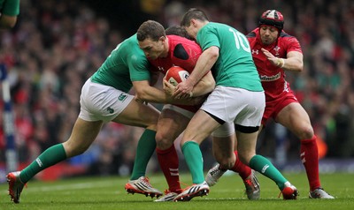 140315 - Wales v Ireland - RBS 6 Nations - George North of Wales is tackled by Robbie Henshaw and Jonny Sexton of Ireland