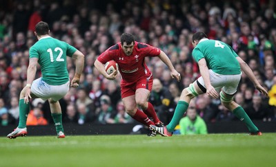 140315 - Wales v Ireland - RBS 6 Nations - Aaron Jarvis of Wales is tackled by Devin Toner of Ireland