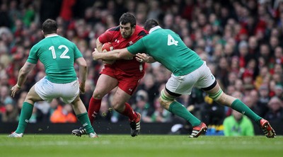 140315 - Wales v Ireland - RBS 6 Nations - Aaron Jarvis of Wales is tackled by Devin Toner of Ireland