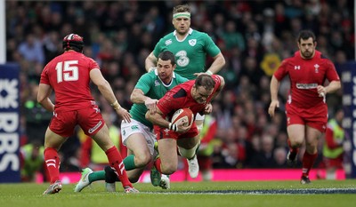 140315 - Wales v Ireland - RBS 6 Nations - Jamie Roberts of Wales is tackled by Rob Kearney of Ireland