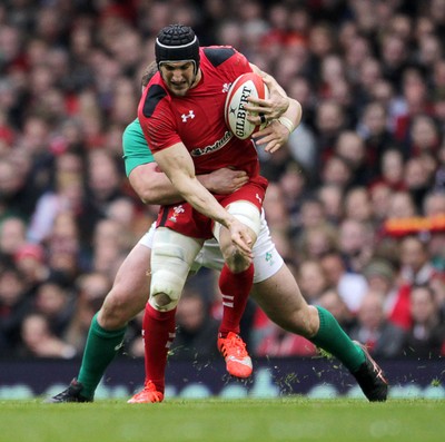 140315 - Wales v Ireland - RBS 6 Nations - Sam Warburton of Wales is tackled by Jack McGrath of Ireland