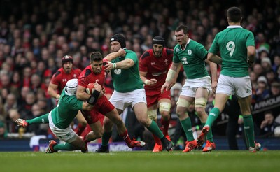 140315 - Wales v Ireland - RBS 6 Nations - Rhys Webb of Wales is tackled by Rory Best and Mike Ross of Ireland