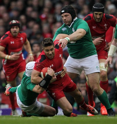 140315 - Wales v Ireland - RBS 6 Nations - Rhys Webb of Wales is tackled by Rory Best and Mike Ross of Ireland