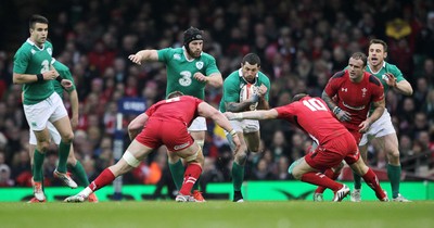 140315 - Wales v Ireland - RBS 6 Nations - Rob Kearney of Ireland is tackled by Dan Lydiate and Dan Biggar of Wales