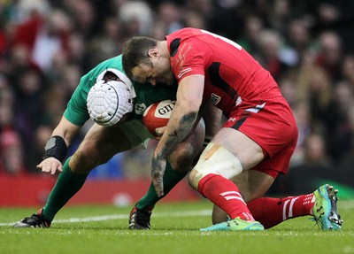 140315 - Wales v Ireland - RBS 6 Nations - Rory Best of Ireland is tackled by Jamie Roberts of Wales