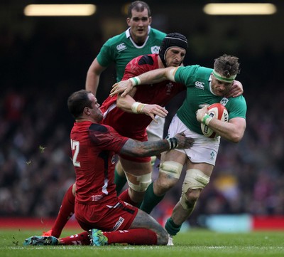 140315 - Wales v Ireland - RBS 6 Nations - Jamie Heaslip of Ireland is tackled by Jamie Roberts and Luke Charteris of Wales