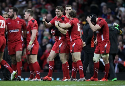 140315 - Wales v Ireland - RBS 6 Nations - Dan Biggar and Leigh Halfpenny of Wales celebrate at full time