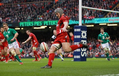 140315 - Wales v Ireland - RBS 6 Nations - Jonathan Davies of Wales kicks upfield