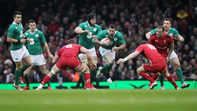 140315 - Wales v Ireland - RBS 6 Nations - Rob Kearney of Ireland is tackled by Dan Lydiate and Dan Biggar of Wales