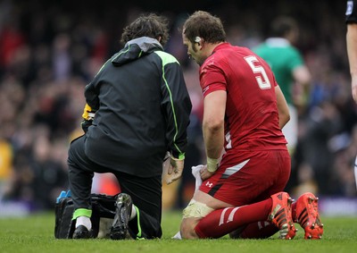 140315 - Wales v Ireland - RBS 6 Nations - Alun Wyn Jones of Wales is seen to by a medic