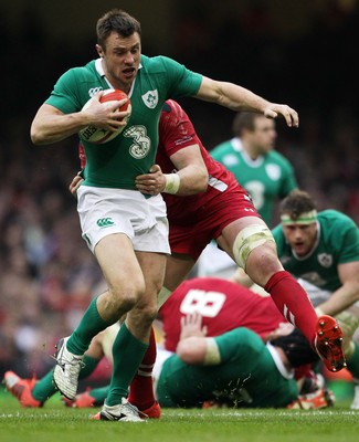 140315 - Wales v Ireland - RBS 6 Nations - Tommy Bowe of Ireland is tackled by Alun Wyn Jones of Wales