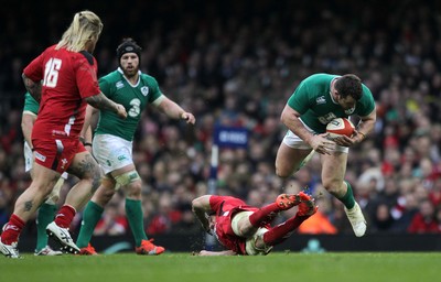 140315 - Wales v Ireland - RBS 6 Nations - Cian Healy of Ireland is tackled by Luke Charteris of Wales