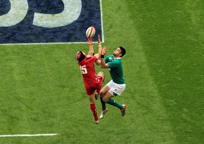 140315 - Wales v Ireland - RBS 6 Nations -Leigh Halfpenny of Wales beats Conor Murray of Ireland to a high ball