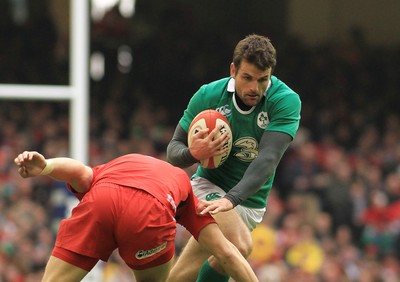 140315 - Wales v Ireland - RBS 6 Nations -Jarad Payne of Ireland takes on Dan Biggar of Wales