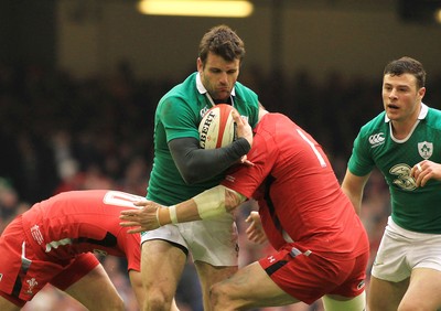 140315 - Wales v Ireland - RBS 6 Nations -Jarad Payne of Ireland is tackled by Gethin Jenkins of Wales