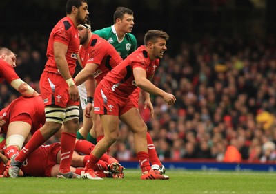 140315 - Wales v Ireland - RBS 6 Nations -Rhys Webb of Wales struggles with an injury