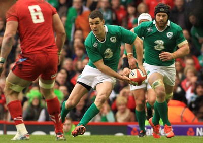 140315 - Wales v Ireland - RBS 6 Nations -Johnny Sexton of Ireland takes on Dan Lydiate of Wales