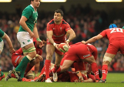 140315 - Wales v Ireland - RBS 6 Nations -Mike Phillips of Wales gets the ball away