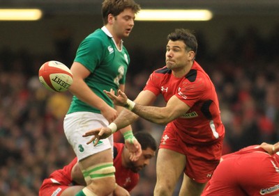 140315 - Wales v Ireland - RBS 6 Nations -Mike Phillips of Wales gets the ball away