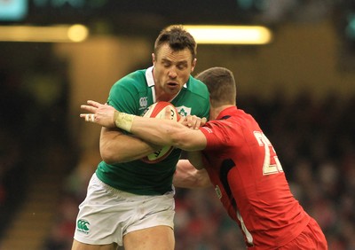 140315 - Wales v Ireland - RBS 6 Nations -Tommy Bowe of Ireland is tackled by Scott Williams of Wales