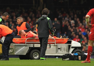 140315 - Wales v Ireland - RBS 6 Nations -Samson Lee of Wales leaves the field on a stretcher