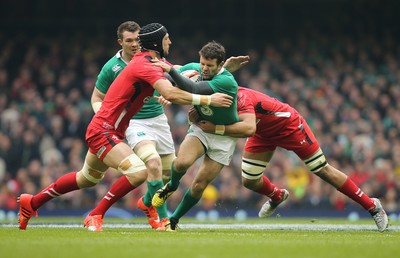 140315 - Wales v Ireland, RBS 6 Nations 2015 - Jared Payne of Ireland is tackled by Luke Charteris of Wales and Taulupe Faletau of Wales