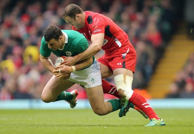 140315 - Wales v Ireland, RBS 6 Nations 2015 - Robbie Henshaw of Ireland is tackled by Jamie Roberts of Wales