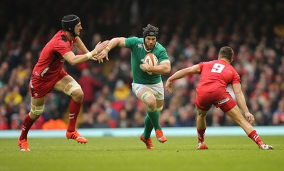 140315 - Wales v Ireland, RBS 6 Nations 2015 - Sean OÕBrien of Ireland is tackled by Luke Charteris of Wales and Rhys Webb of Wales