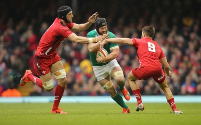 140315 - Wales v Ireland, RBS 6 Nations 2015 - Sean OÕBrien of Ireland is tackled by Luke Charteris of Wales and Rhys Webb of Wales