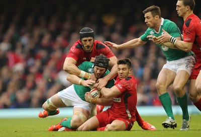 140315 - Wales v Ireland, RBS 6 Nations 2015 - Sean OÕBrien of Ireland is tackled by Luke Charteris of Wales and Rhys Webb of Wales