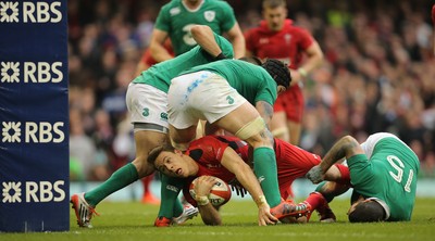 140315 - Wales v Ireland, RBS 6 Nations 2015 - Liam Williams of Wales looks for the try line after being tackled by Rob Kearney of Ireland