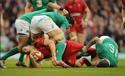 140315 - Wales v Ireland, RBS 6 Nations 2015 - Liam Williams of Wales looks for the try line after being tackled by Rob Kearney of Ireland