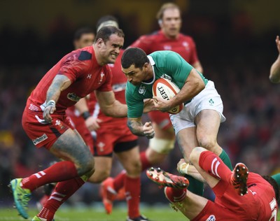 140315 - Wales v Ireland - RBS Six Nations - Ireland's Rob Kearney is tackled by Dan Biggar(ground) and Jamie Roberts