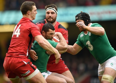 140315 - Wales v Ireland - RBS Six Nations - Rob Kearney of Ireland is tackled by George North and Scott Baldwin of Wales