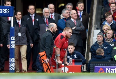 140315 - Wales v Ireland - RBS Six Nations - Samson Lee of Wales returns to the sidelines on crutches