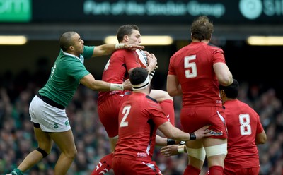 140315 - Wales v Ireland - RBS Six Nations - George North of Wales fields a kick ahead of Simon Zebo of Ireland